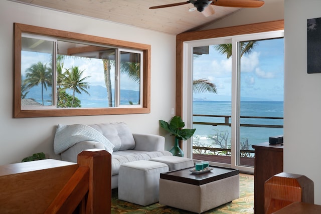 interior space with ceiling fan, a water view, wooden ceiling, and lofted ceiling