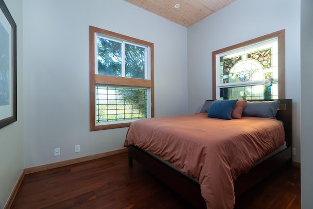 bedroom featuring wood ceiling and dark wood-type flooring