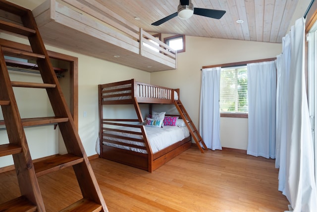 unfurnished bedroom featuring vaulted ceiling, light hardwood / wood-style flooring, ceiling fan, and wood ceiling