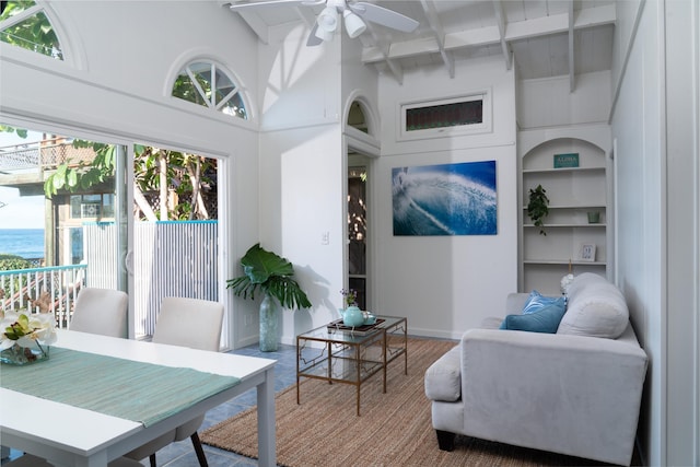 living room with beam ceiling, ceiling fan, high vaulted ceiling, and wood-type flooring