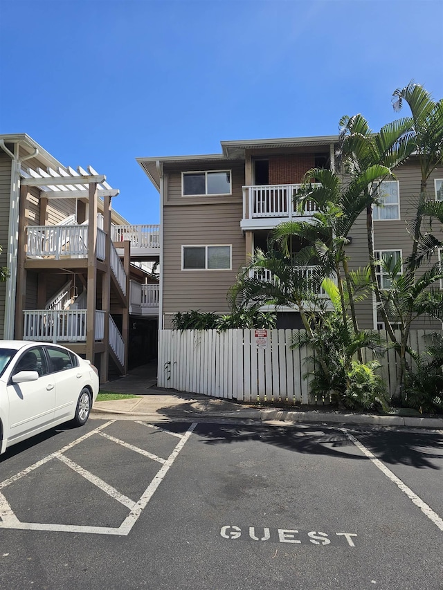 view of property with uncovered parking