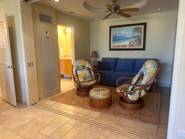 living room featuring ceiling fan and light tile patterned floors