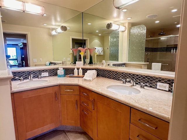 50 Nohea Kai Dr Unit 1-703, Lahaina, HI 96761 - bathroom with double vanity, tasteful backsplash, a shower stall, and recessed lighting