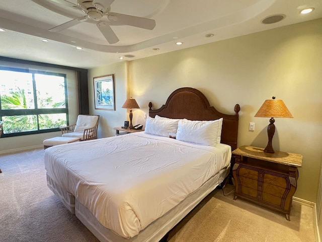 bedroom featuring light colored carpet and ceiling fan