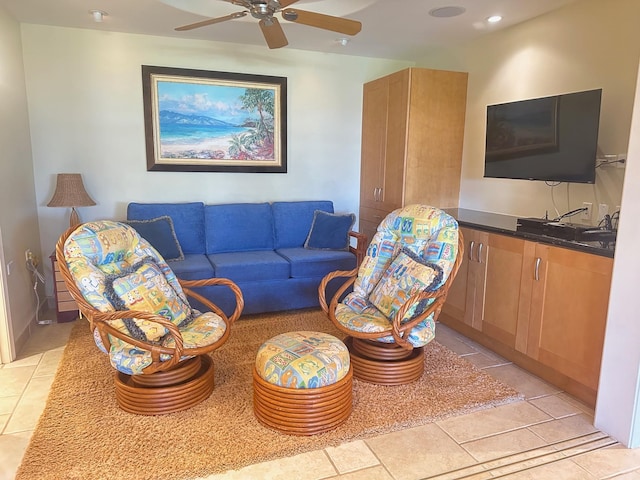 tiled living room featuring ceiling fan