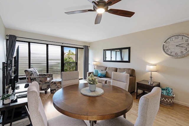 dining room with ceiling fan and light hardwood / wood-style flooring