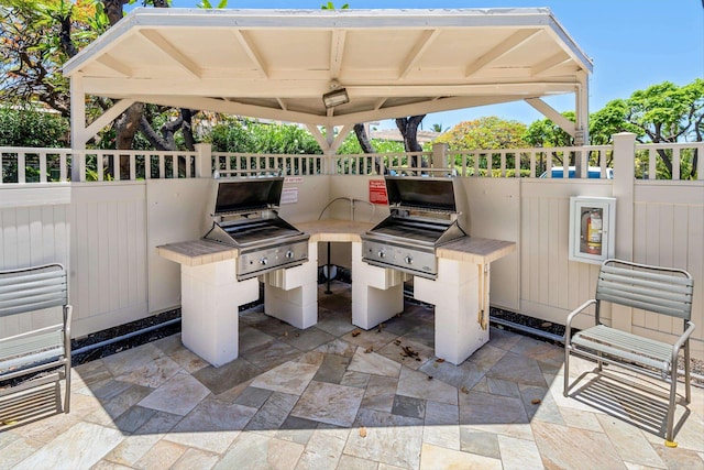 view of patio / terrace featuring exterior kitchen and area for grilling