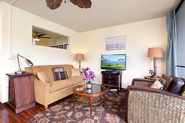 living room featuring dark hardwood / wood-style floors and ceiling fan