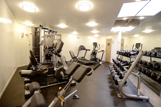 gym with a textured ceiling