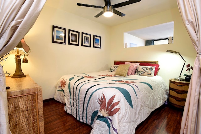 bedroom featuring ceiling fan and dark wood-type flooring