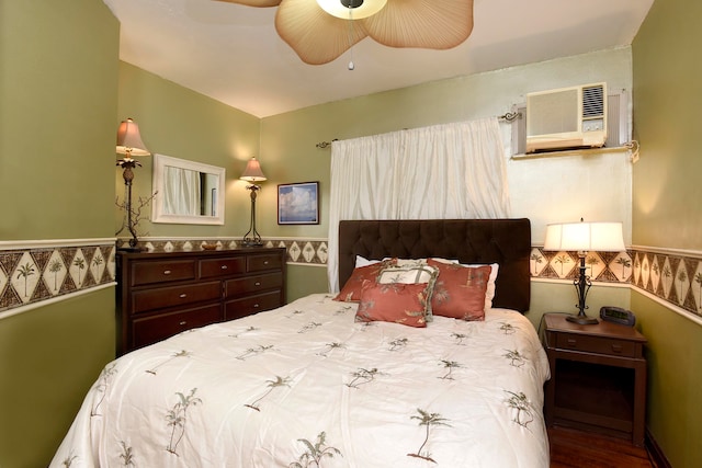 bedroom featuring wood-type flooring, a wall mounted air conditioner, and ceiling fan