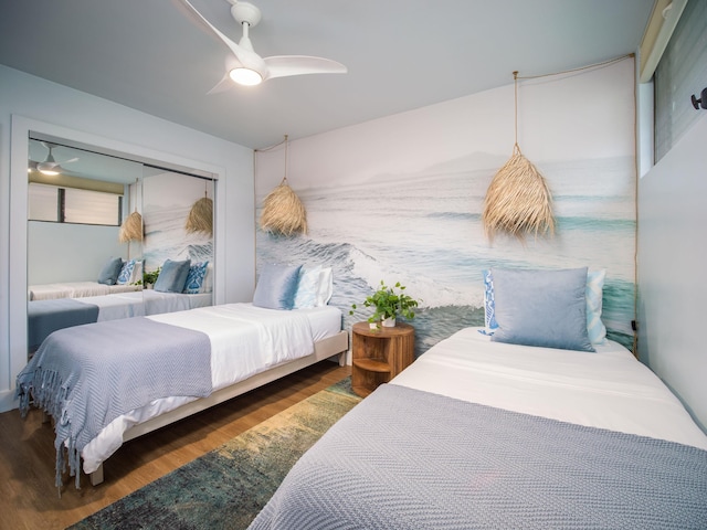 bedroom featuring ceiling fan and wood finished floors