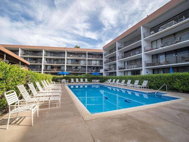 community pool featuring a patio area