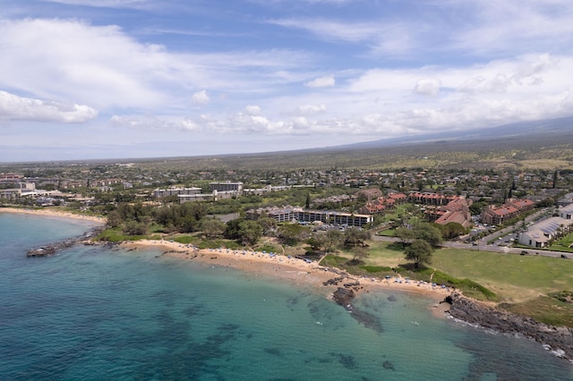 bird's eye view featuring a water view and a beach view