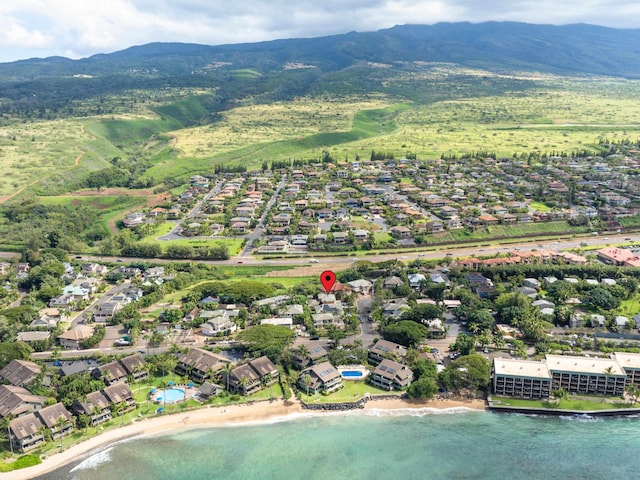 drone / aerial view with a residential view and a water and mountain view