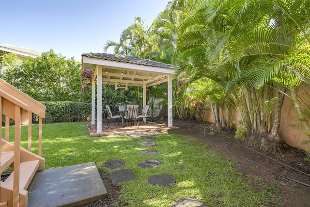 view of yard with a fenced backyard, a patio, and a gazebo