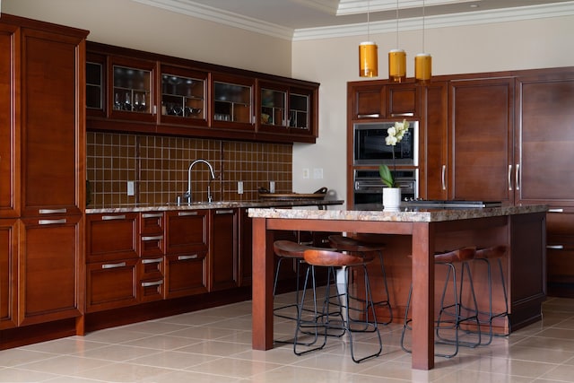 93 Makakehau St Unit G5, Kihei, HI 96753 - kitchen with oven, built in microwave, ornamental molding, tasteful backsplash, and a kitchen bar