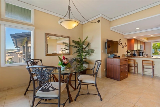 dining area with ornamental molding and light tile floors