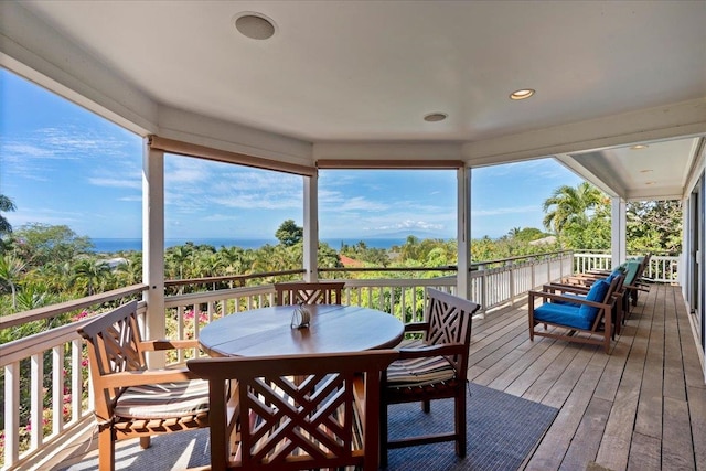 wooden terrace with a water view