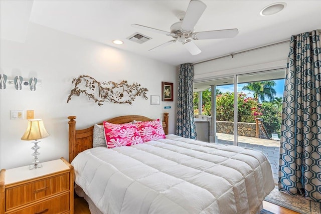 bedroom with access to exterior, hardwood / wood-style flooring, and ceiling fan