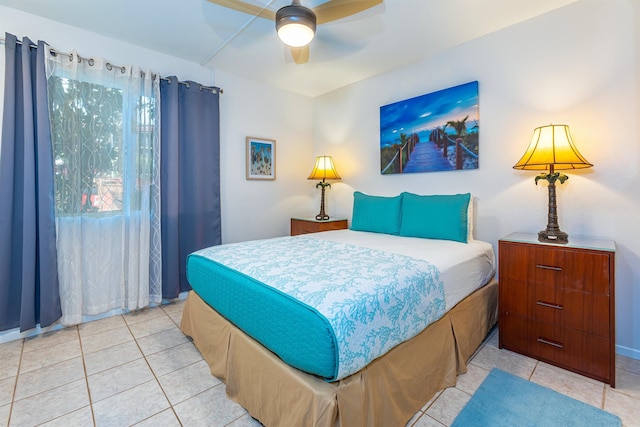 bedroom with ceiling fan and light tile patterned flooring