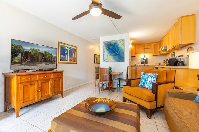 tiled living room featuring ceiling fan