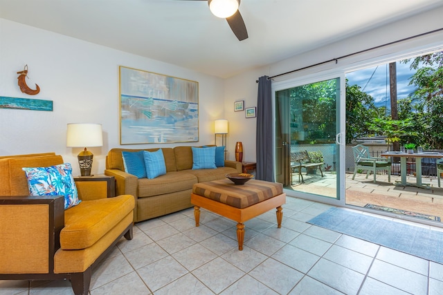 living room featuring light tile patterned floors and ceiling fan