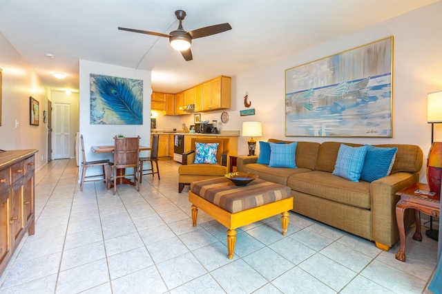 tiled living room featuring ceiling fan