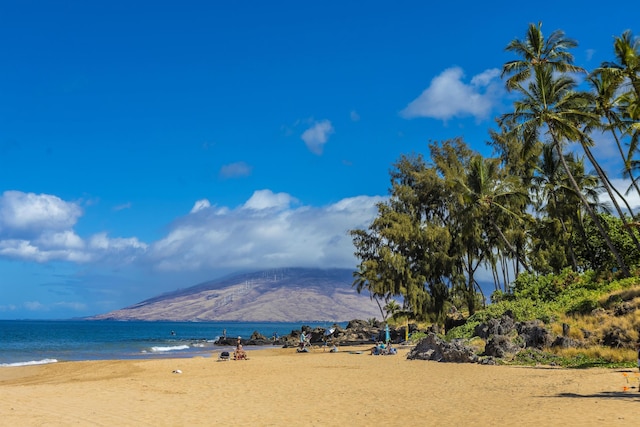 property view of water featuring a mountain view and a view of the beach