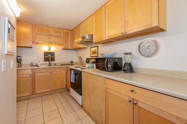 kitchen featuring white electric range, light tile patterned floors, light brown cabinetry, and sink