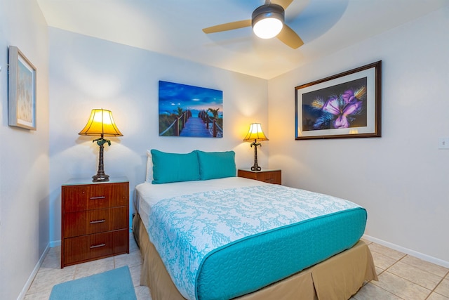 tiled bedroom with ceiling fan