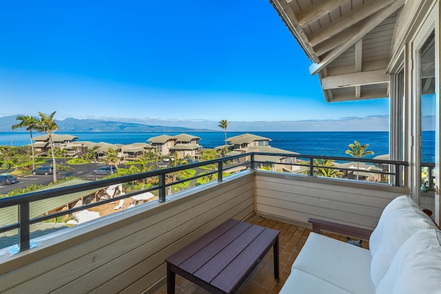 balcony with a water and mountain view