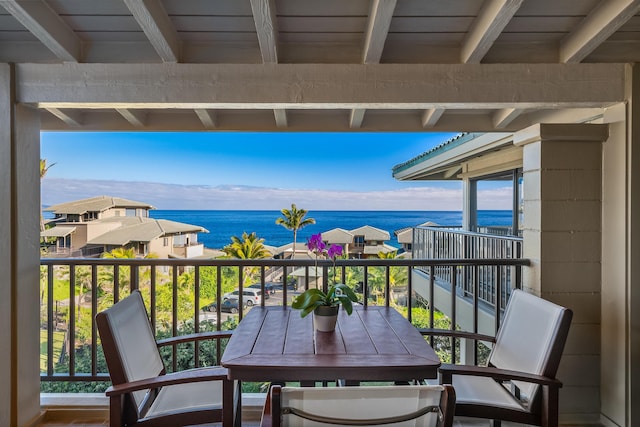 balcony featuring a water view