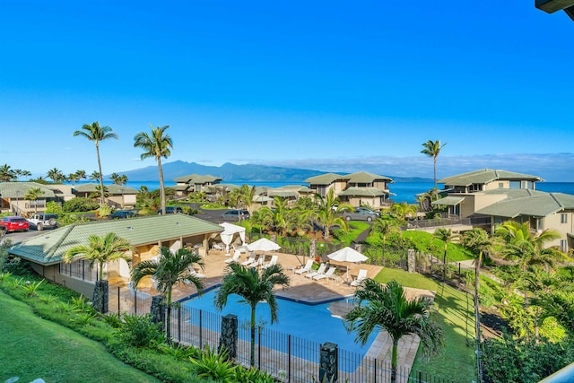 birds eye view of property featuring a water and mountain view