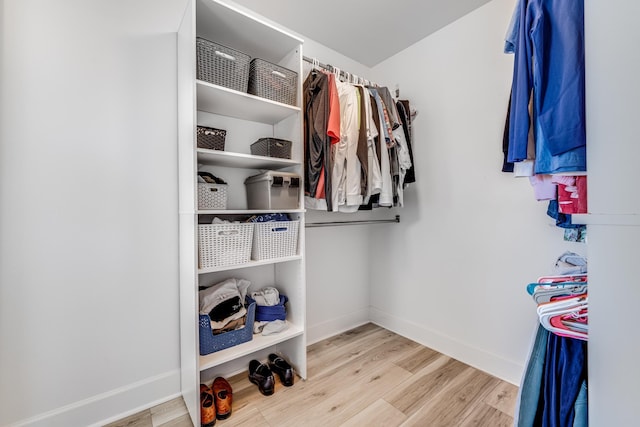 spacious closet featuring wood finished floors