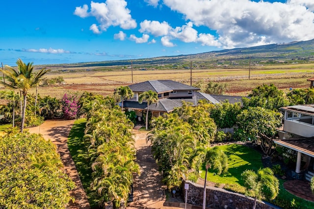 drone / aerial view featuring a mountain view and a rural view