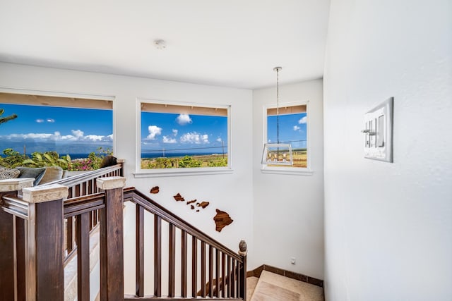 staircase featuring baseboards