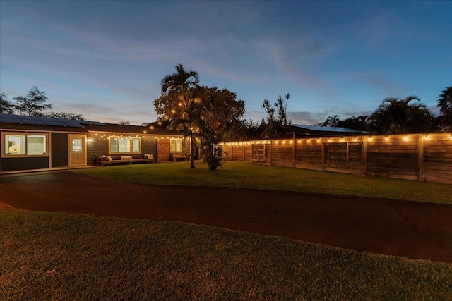 view of yard at dusk