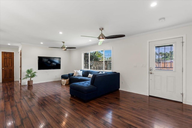 living room featuring crown molding, plenty of natural light, and dark hardwood / wood-style flooring