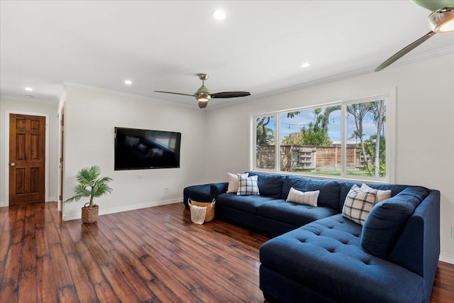 living room with dark wood-type flooring, ceiling fan, and ornamental molding