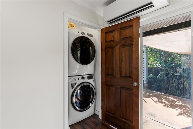 clothes washing area with dark hardwood / wood-style flooring, ornamental molding, an AC wall unit, and stacked washer / dryer