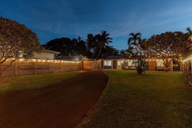 view of yard at dusk