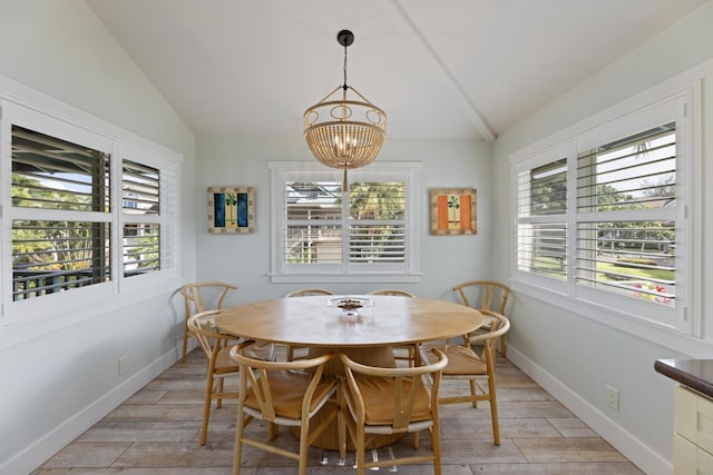 dining space featuring light wood-type flooring, lofted ceiling, and a healthy amount of sunlight