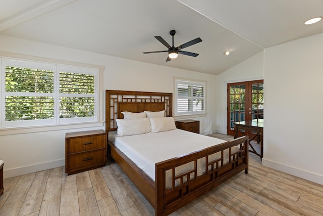 bedroom with french doors, baseboards, light wood-style floors, and vaulted ceiling