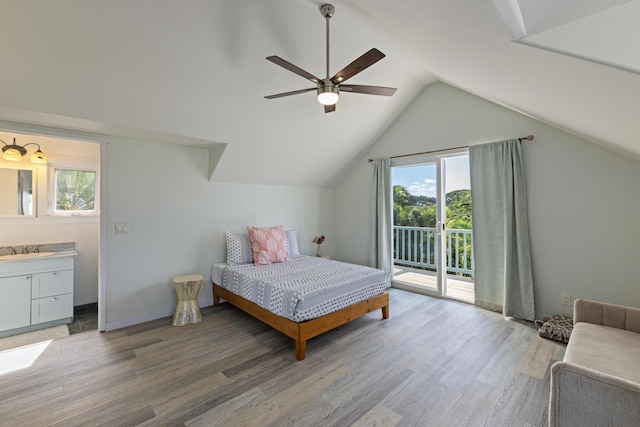 bedroom with light wood-style flooring, a sink, ceiling fan, access to exterior, and vaulted ceiling