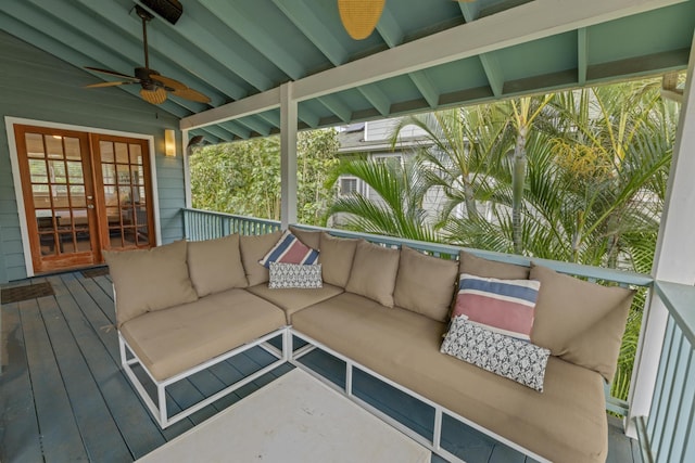 exterior space with lofted ceiling with beams, a healthy amount of sunlight, and ceiling fan