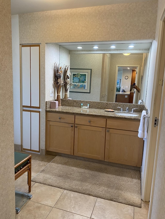 bathroom with vanity and tile patterned flooring