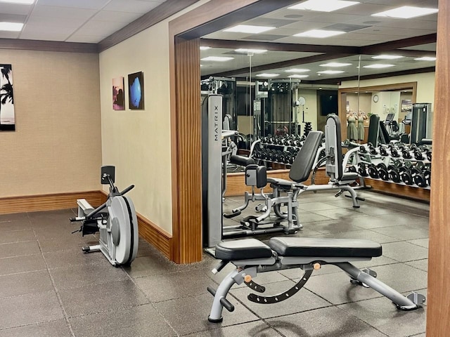 exercise room featuring a drop ceiling