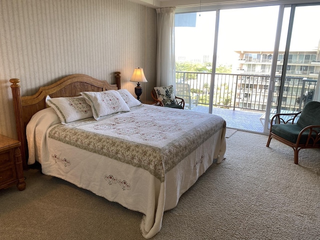 bedroom featuring access to outside and carpet flooring