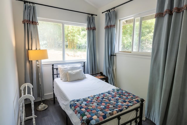 55 Palulu Way Unit A, Haiku, HI 96708 - bedroom with multiple windows, lofted ceiling, and dark wood finished floors
